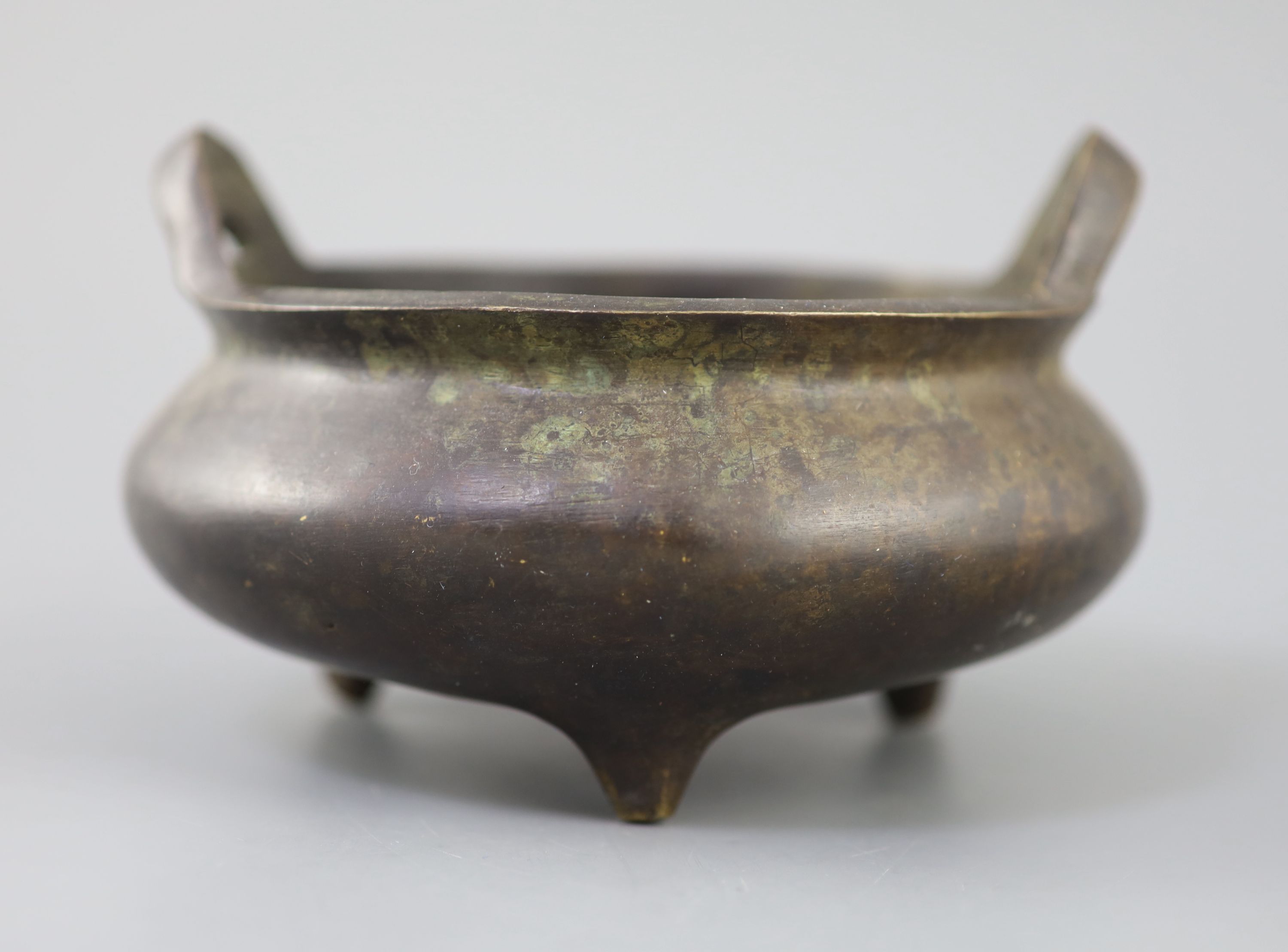 A Chinese bronze tripod censer, Xuande mark but 19th century, 16cm diameter